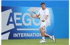 EASTBOURNE, ENGLAND - JUNE 14: Ken Skupski of Great Britain plays a forehand against Remi Boutillier of France during their Men's Singles qualifying match on day one of the Aegon International at Devonshire Park on June 14, 2014 in Eastbourne, England.  (Photo by Steve Bardens/Getty Images)